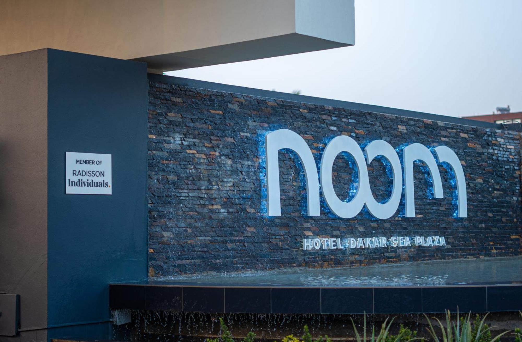 Noom Hotel Dakar Sea Plaza, A Member Of Radisson Individuals Exterior foto The hotel's logo
